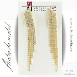 Aretes de noche dorados con cristal blanco 7 x 1 cms. Elegir los aretes adecuados puede transformar por completo tu atuendo nocturno, añadiendo un toque de sofisticación y elegancia. Al elegir tus aretes, considera el estilo de tu vestido y el peinado que llevarás para asegurarte de que todo el conjunto esté en armonía. ¡Disfruta de tu noche con el brillo perfecto!