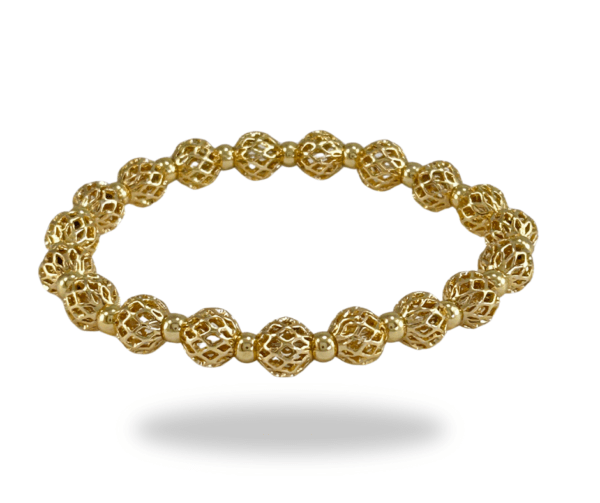 Pulsera elastica con bolitas doradas en acero inoxidable - Las pulseras de acero inoxidable se han convertido en un accesorio de moda imprescindible en la actualidad. Su popularidad se debe a varias razones, entre las cuales destacan su durabilidad, resistencia al desgaste y, por supuesto, su apariencia elegante y moderna.